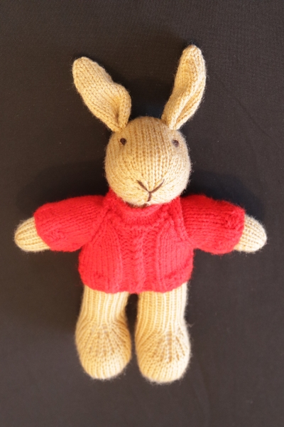 Hand Knitted Boy Rabbit wearing a Red Aran