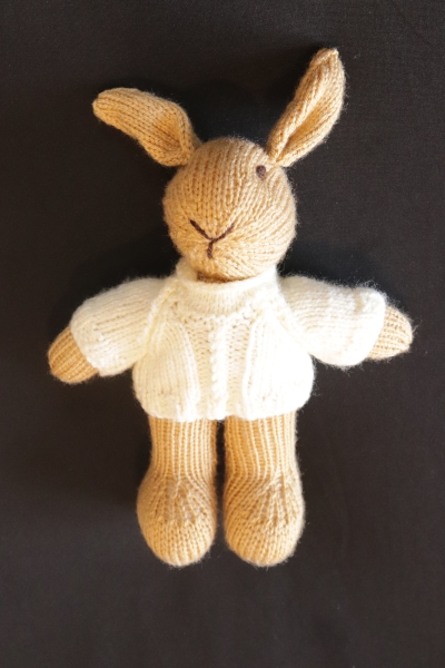 Hand Knitted Boy Rabbit wearing a Cream Aran